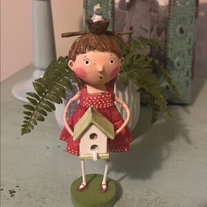 Charming Red and Green Figurine with Birdhouse